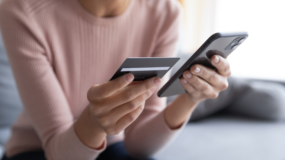 woman getting scammed by common scam area code